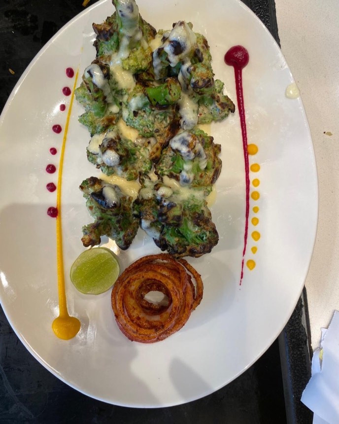 Char-grilled malai broccoli with cheese